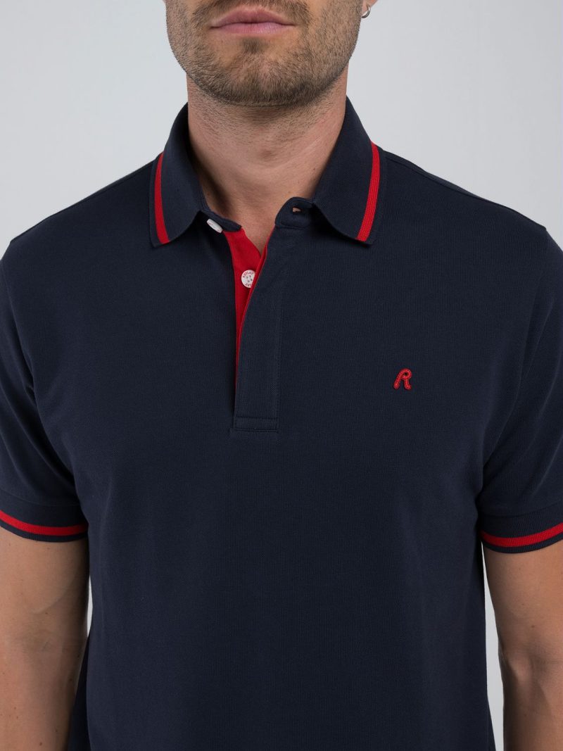 navy polo shirt with red detail