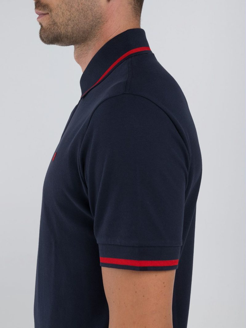 navy polo shirt with red detail