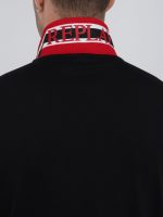 black polo shirt with red and white detail