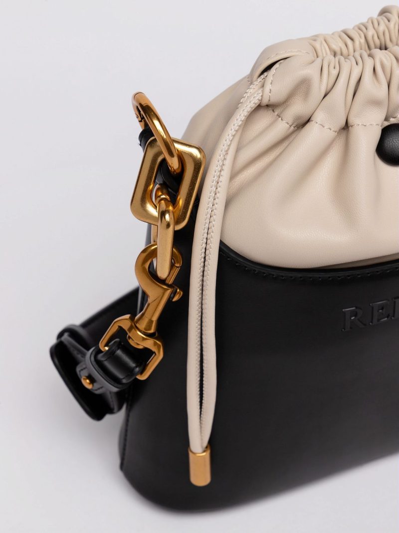 black and nude bucket bag with laces