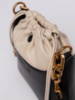 black and nude bucket bag with laces