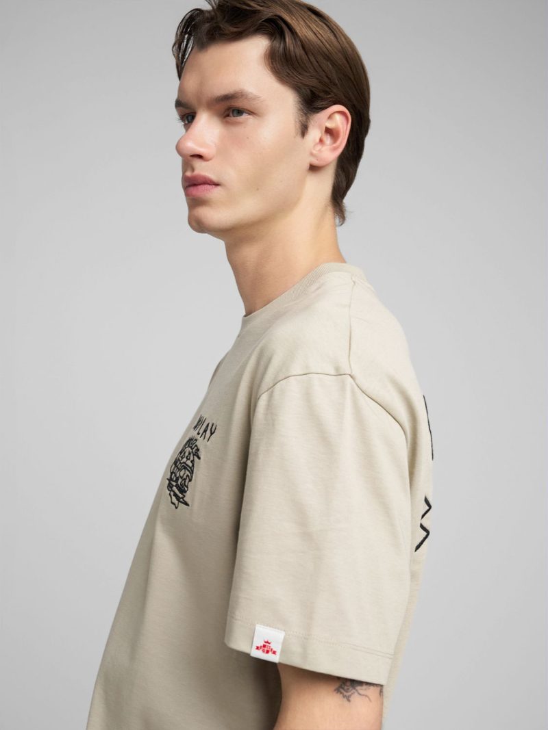 sand t shirt with embossed effect embroidery